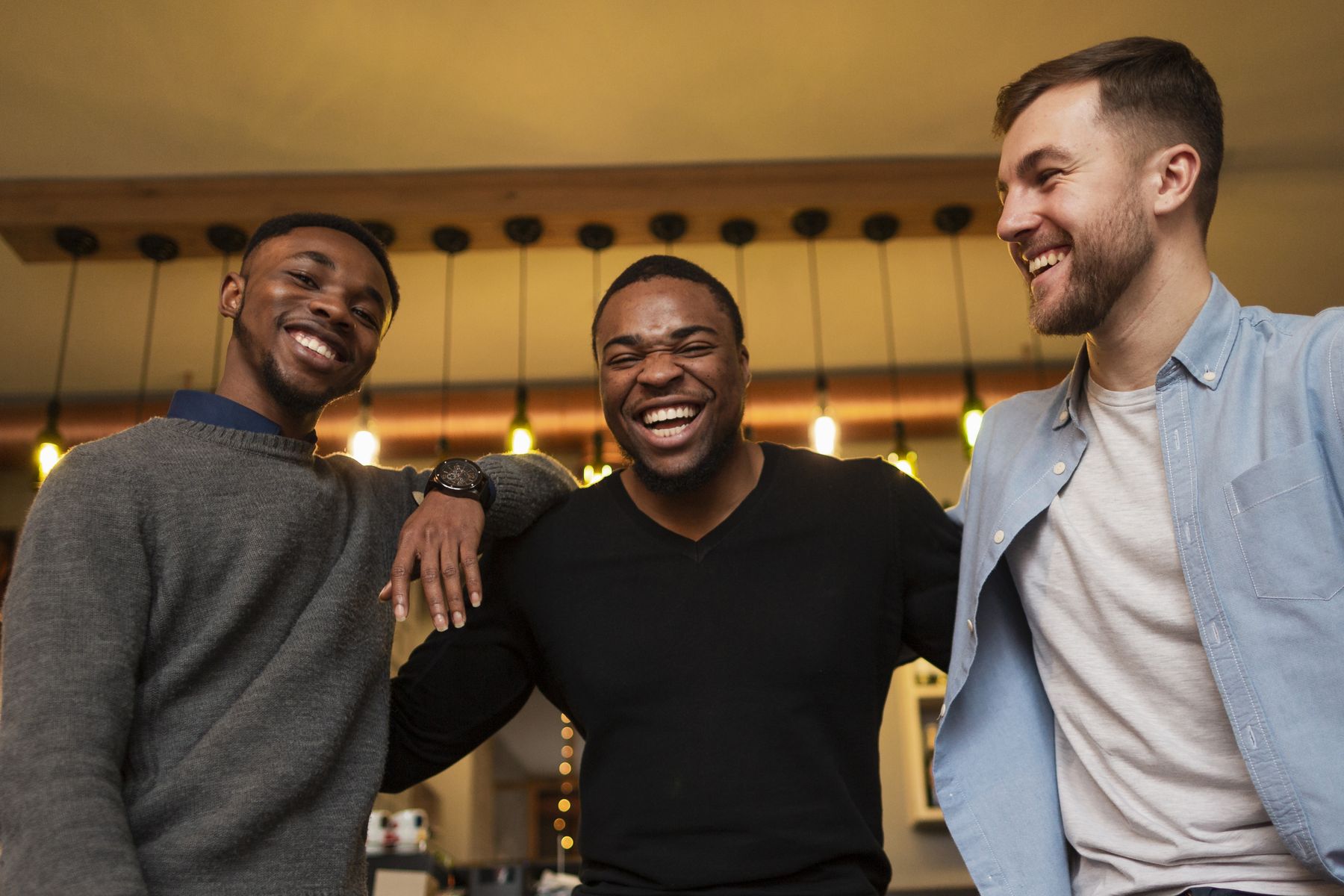 A group of men laughing and enjoying fellowship together
